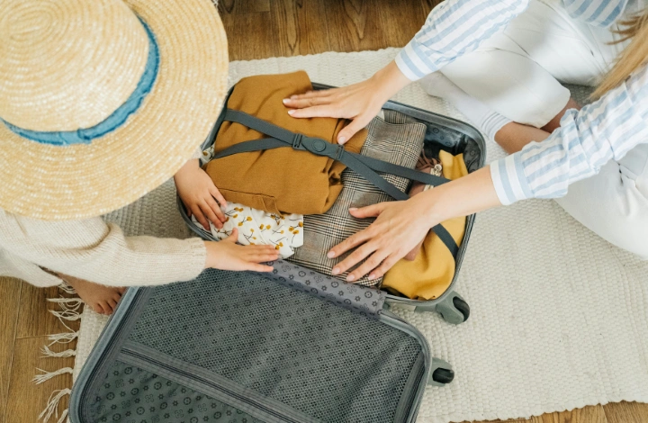 Laundry neatly folded and packed in suitcase before vacation